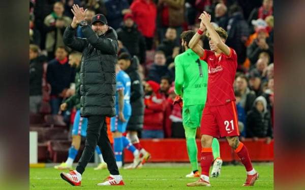 Klopp (kiri) meraikan kemenangan pasukannya selepas berjaya atasi cabaran Atletico.