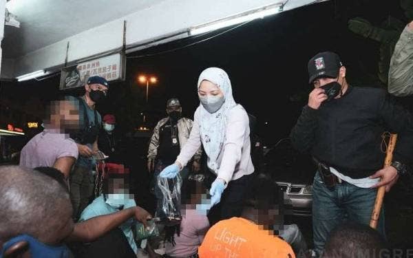 Antara warga asing yang diperiksa dalam serbuan Imigresen di Cyberjaya dan Puchong pada Rabu.