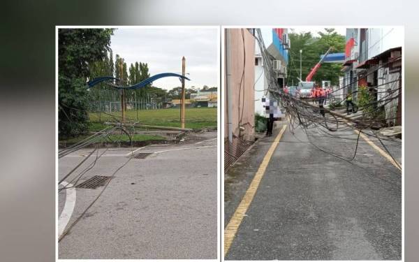 Antara tiang elektrik yang tumbang dipercayai akibat wayar tersangkut pada treler dalam kejadian di Jalan Ahmad Boestaman, Slim River di sini pada Jumaat.