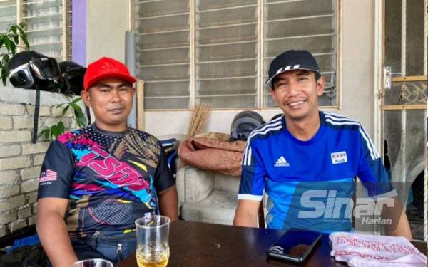 Shahrul Anuar (kanan) dan rakan baiknya Kamarul Azam cukup dikenali dengan sikap suka membantu penduduk dalam kejiranan mereka.