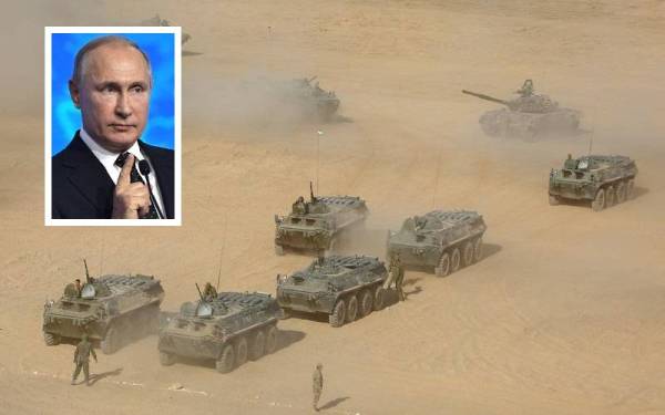 Putin (gambar kecil) memberi amaran tegas beliau mungkin terpaksa mempertimbangkan pilihan lain termasuk tindak balas ketenteraan jika tuntutan jaminan keselamatan dikemukakan pada awal bulan lalu gagal dipenuhi. - Foto Agensi