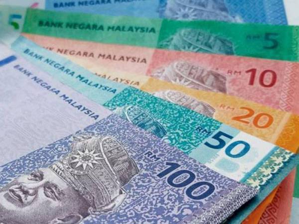 Ringgit merosot berbanding dolar AS pada Khamis berikutan sokongan belian terhadap unit negara maju susulan keputusan Fed. - Gambar hiasan