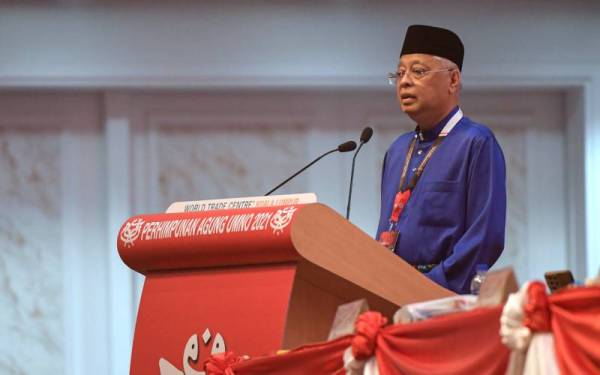 Ismail Sabri menyampaikan ucapan penggulungan sempena Perhimpunan Agung UMNO (PAU) 2021 di Dewan Merdeka, Pusat Dagangan Dunia di Kuala Lumpur pada Sabtu. - Foto Bernama 