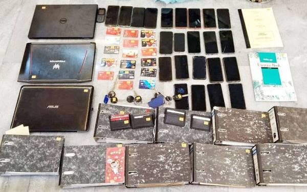 Sebahagian daripada barangan yang dirampas termasuk telefon bimbit, komputer riba dan fail dalam serbuan itu.