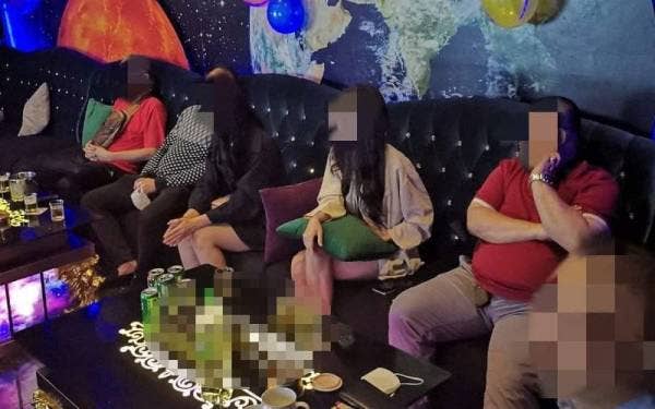Antara pengunjung sebuah pusat karaoke yang diperiksa dalam Op Cantas Khas pada Ahad.