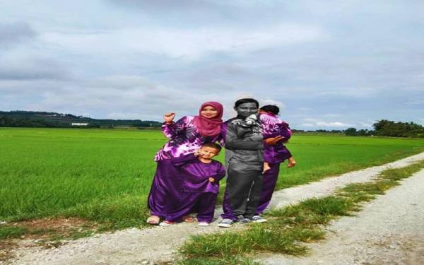 Gambar Muhammad Fazli (kanan) bersama keluarganya yang dirakam ketika meraikan Aidilfitri tahun ini.