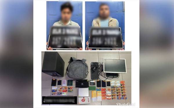 Dua lelaki warga asing ditahan bersama 40 keping kad ATM dipercayai milik peminjam yang dicagar kepada pihak sindiket.