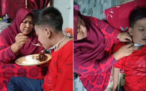 Norizan membantu Muhammad Raeez Ramadhan makan yang menghidap penyakit jantung berlubang di rumahnya Kampung Paya Lang, Batu Anam, Segamat, pada Jumaat.