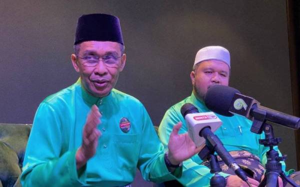 Takiyuddin (kiri) ketika ditemui pada Mesyuarat Agung Tahunan Pas Kawasan Kota Bharu ke 55 di sini pada Sabtu.