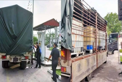 Pegawai penguat kuasa KPDNHEP Perak membuat pemeriksaan terhadap sebuah lori yang dikesan melakukan pengisian berulang kali di Taiping.(Gambar kanan : KPDNHEP Perak menemui enam tangki fiber yang disyaki berisi minyak diesel dalam lori berkenaan. Foto: ihsan KPDNHEP Perak)