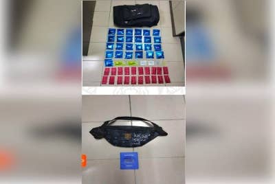 Polis merampas pelbagai dadah yang dibawa seorang lelaki di sebuah kondominium di Taiping. - Foto ihsan polis