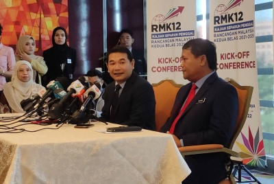 Rafizi ketika sidang media selepas merasmikan Kick-Off Conference Kajian Separuh Penggal RMK12, pada Selasa.