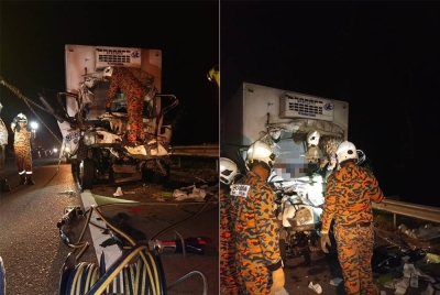 Anggota bomba mengeluarkan dua mangsa yang tersepit dalam kemalangan melibatkan lori dan treler di Kilometer 76.0 Lebuhraya Utara Selatan dekat Batu Pahat pada Rabu