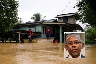 (Gambar kecil: Hanafiah) Situasi banjir di Kampung Besut berikutan hujan lebat berterusan pada Ahad. - Foto Bernama