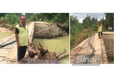 Mansor menunjukkan sisa kayu yang tersangkut pada bahagian jambatan hampir putus. 