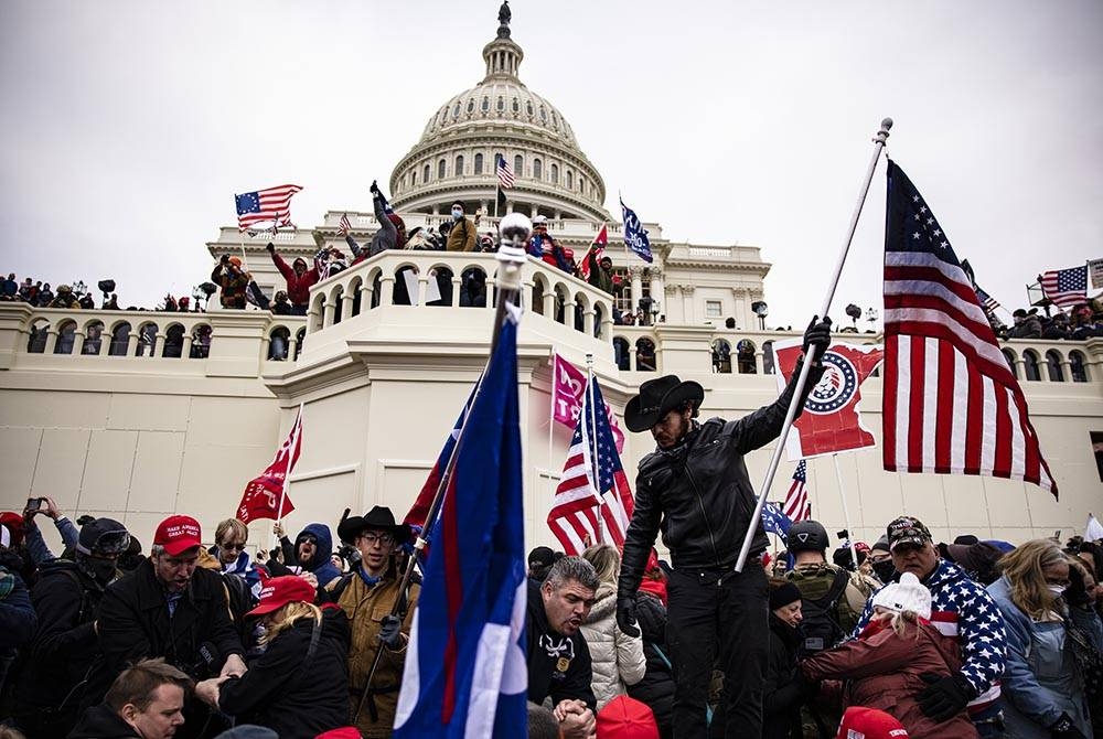 Les partisans de Trump prennent violemment d'assaut le Capitole lors des événements embarrassants de la démocratie américaine le 6 janvier 2021. - Agency Photo