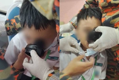 Bibir seorang kanak-kanak lelaki tersepit pada penutup botol air sehingga terpaksa dikejarkan ke klinik untuk mendapatkan bantuan. - Foto PGOKL