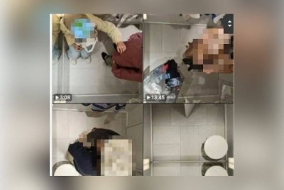 Tangkap layar video tular yang memaparkan kamera tersembunyi di bilik persalinan sebuah pusat membeli belah.