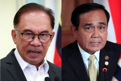 Anwar (kiri), Prayuth (kanan)