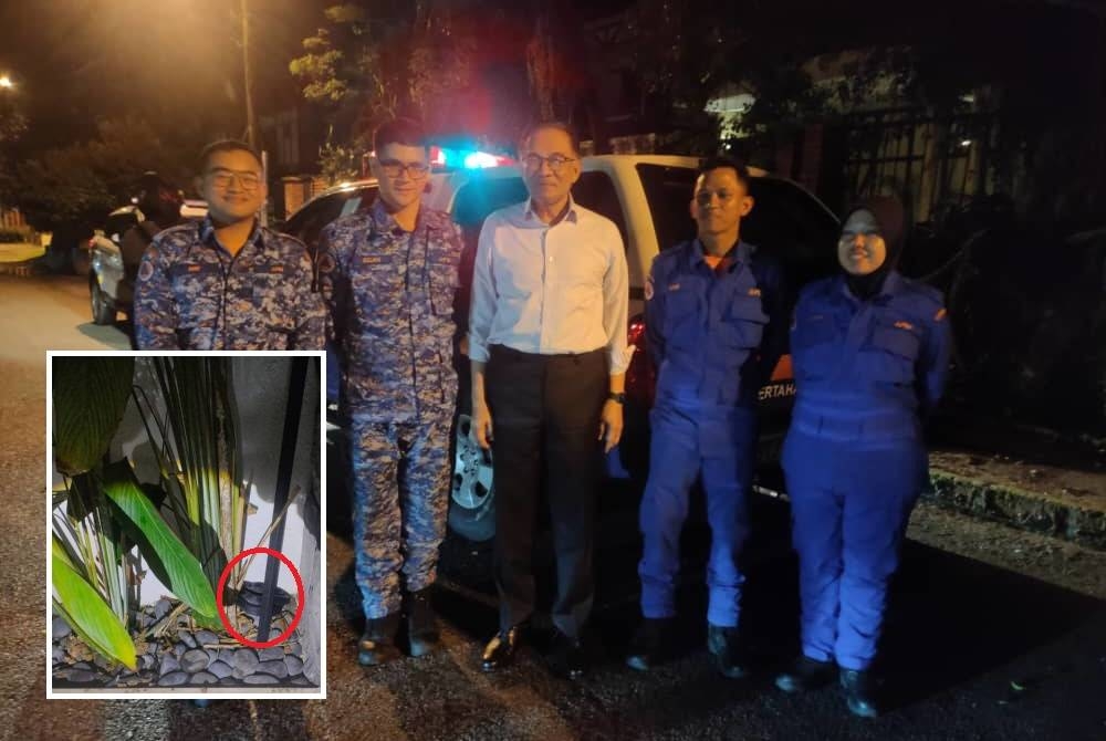 Anwar berkesempatan beramah mesra bersama anggota APM sejurus operasi selesai dijalankan. (Gambar kecil: Ular tedung yang ditemui di tepi pondok pengawal kediaman Perdana Menteri pada Isnin.)