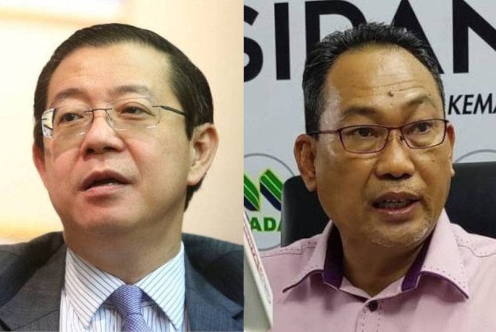 Guan Eng (kiri) dan Awang ditegur ketika sesi pertanyaan-pertanyaan bagi jawab lisan pada persidangan Parlimen pada Rabu.