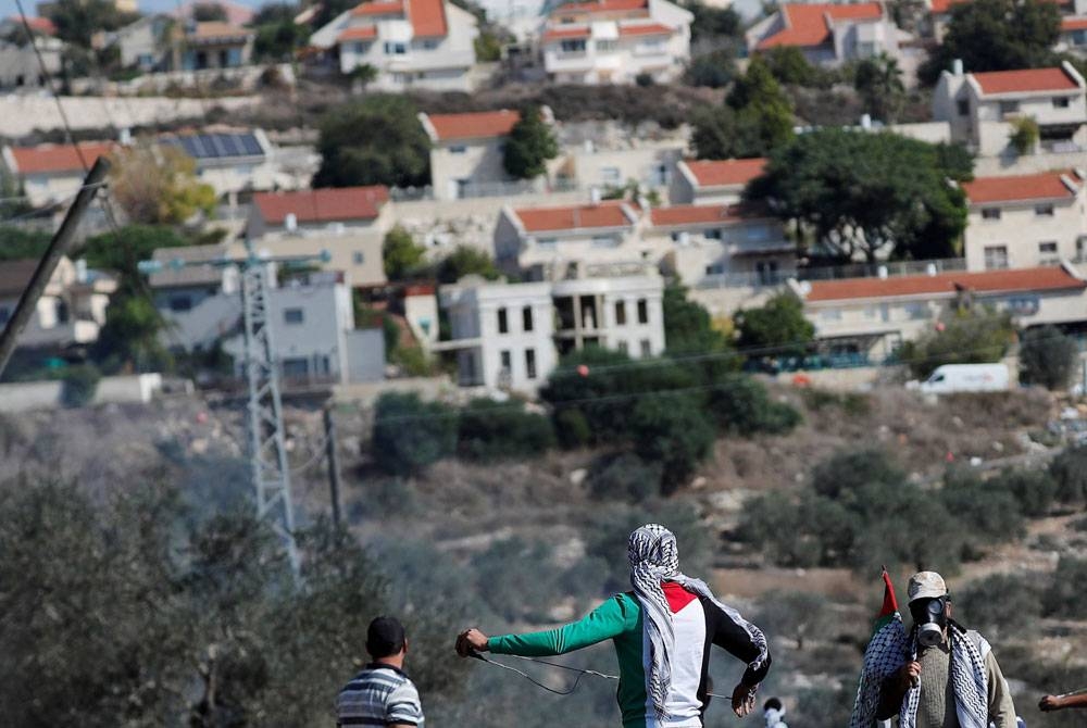Warga Palestina memprotes di Tepi Barat setelah Israel menyetujui pemukiman di Tepi Barat.  - Agensi
