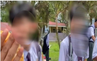 Tangkap layar video tular pelajar lelaki mengeluarkan kata-kata kesat terhadap pembuat kertas soalan peperiksaan subjek Sejarah SPM.