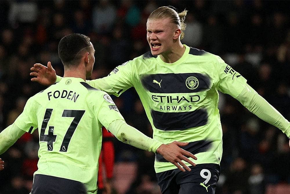 Haaland (kanan) tampil cemerlang untuk City ketika menentang Bournemouth. FOTO: AFP