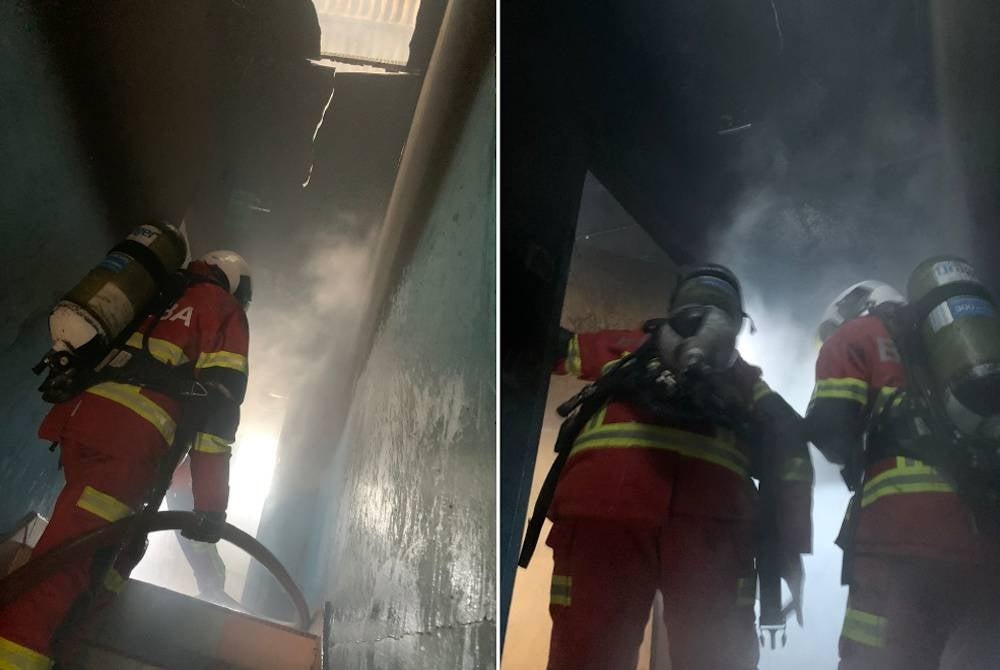 Pasukan bomba mengawal kebakaran dari terus merebak.