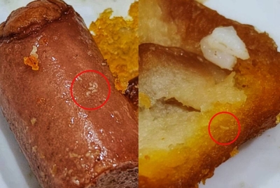 Ulat pada sosej dan roti yang dibeli Nor Suhaili di Temerloh pada Jumaat.