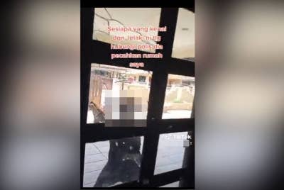 Tangkap layar rakaman lelaki melakukan khianat dengan memecahkan cermin pintu rumah bekas isterinya dalam kejadian di Taman Pinji Indah, Selasa lalu. - Foto ihsan pembaca