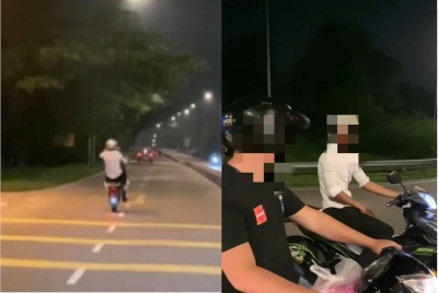Tangkap layar video yang memaparkan lelaki Pakistan melakukan aksi 'wheelie' di Jalan Kota Tinggi- Kluang.