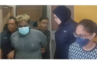 S Nagendran (kiri), A Sangeetha dibawa keluar selepas mengaku bersalah di Mahkamah Sesyen Johor Bahru pada Rabu.