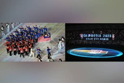Kontinjen Malaysia semasa upacara perasmian Sukan SEA Kemboja 2023 di Stadium Nasional Morodok Techo, Phnom Penh pada Jumaat. Bendera Kemboja dibawa masuk ke Stadium Nasional Morodok Techo pada upacara perasmian Sukan SEA Kemboja 2023 di Phnom Penh. - FOTO AFP