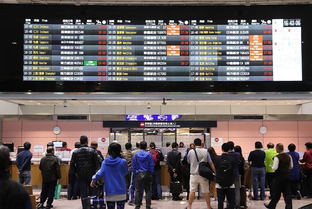 TAIPEI, TAIWAN - NOVEMBER 22, 2018: People wait at Taoyuan International Airport near Taipei, Taiwan. It is Taiwan's largest and busiest airport.