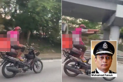 Tangkap layar rakaman video yang memaparkan aksi seorang lelaki yang menunggang motosikal secara berbahaya di Jalan Lingkaran Tengah 2-Pandan Indah, Ampang.
