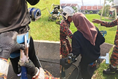 Anggota bomba menggunakan peralatan khas untuk memotong buaian bagi mengeluarkan mangsa.