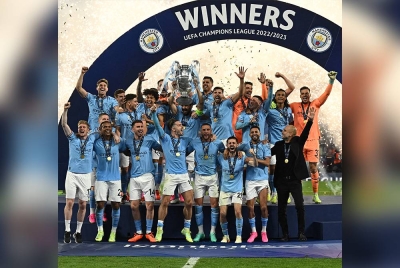 Pemain City meraikan kejayaan menjulang trofi Liga Juara-Juara. FOTO: AFP