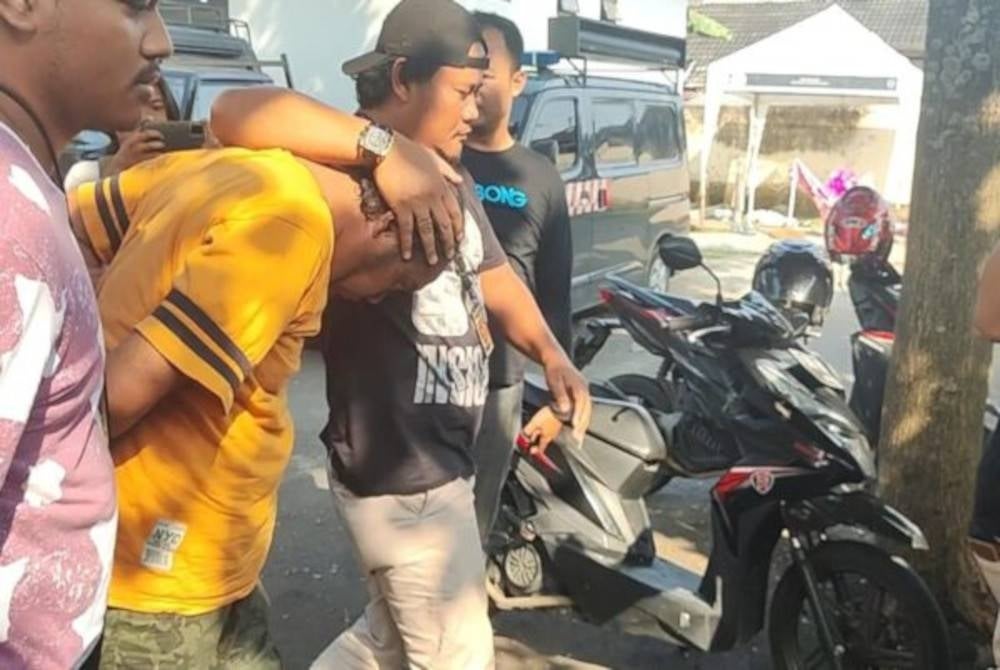 Suspek pada mulanya terkejut dengan kematian isterinya namun akhirnya mengaku kerap memukul mangsa yang masih dalam berpantang. - Foto Agensi