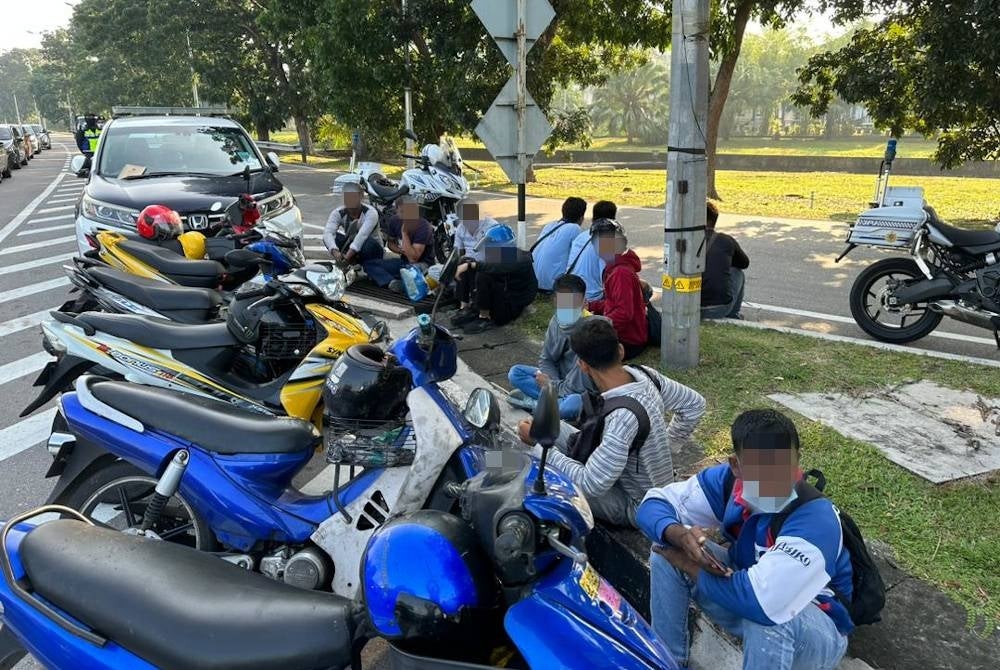 Antara penunggang motosikal warga asing yang ditahan dalam Ops Pewa di sekitar Seberang Jaya pada Khamis.