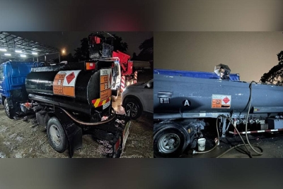 Aktiviti seleweng minyak diesel berselindung di sebalik bengkel membaiki kenderaan di Jalan Kuala Sawah, Rantau di sini terbongkar selepas diserbu dalam Ops Tiris, pada Selasa. -Foto: KPDN Negeri Sembilan