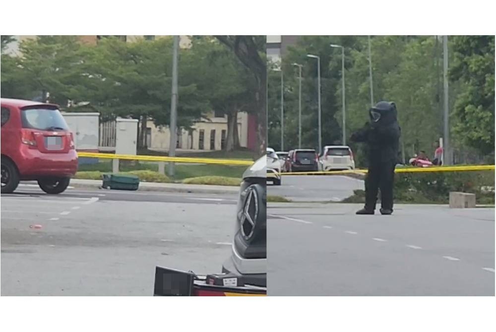 Seorang anggota polis dari pasukan pemusnah bom dilihat berada di lokasi. - Foto tular media sosial