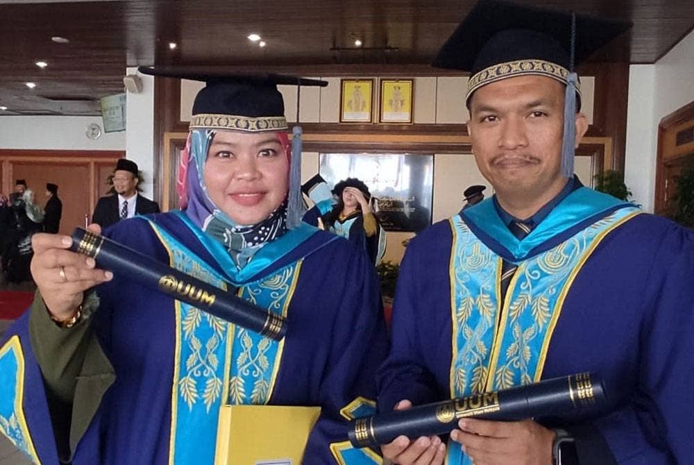 Surirani (kiri) dan Mohd Firdaus antara 35 pegawai polis yang berjaya menggenggam Ijazah Sarjana Sains (Pengajian Strategik) UUM.