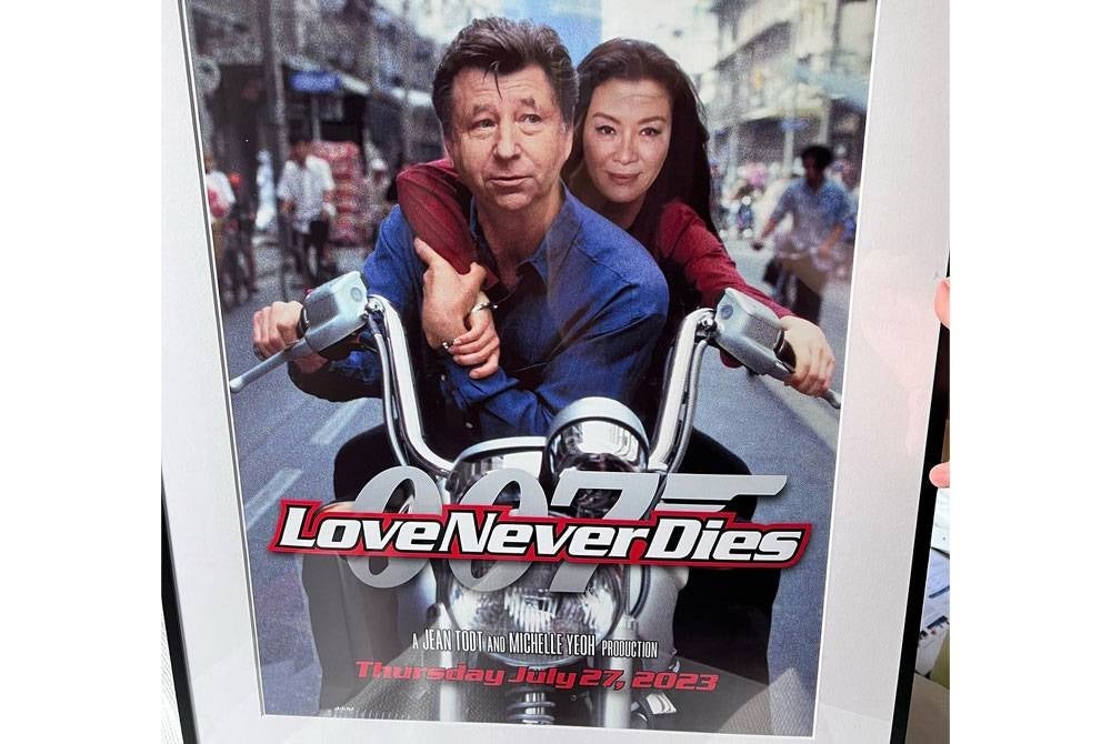 Michelle turut berkongsi poster filem lakonannya 'Tomorrow Never Dies' yang disunting dengan wajah suaminya berserta judul Love Never Dies.