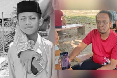 Mohammad Fariz Irfan (kiri), Abdul Halim (kanan) menunjukkan gambar anaknya ketika ditemui pemberita di pantai Teluk Batik di sini pada Ahad.
