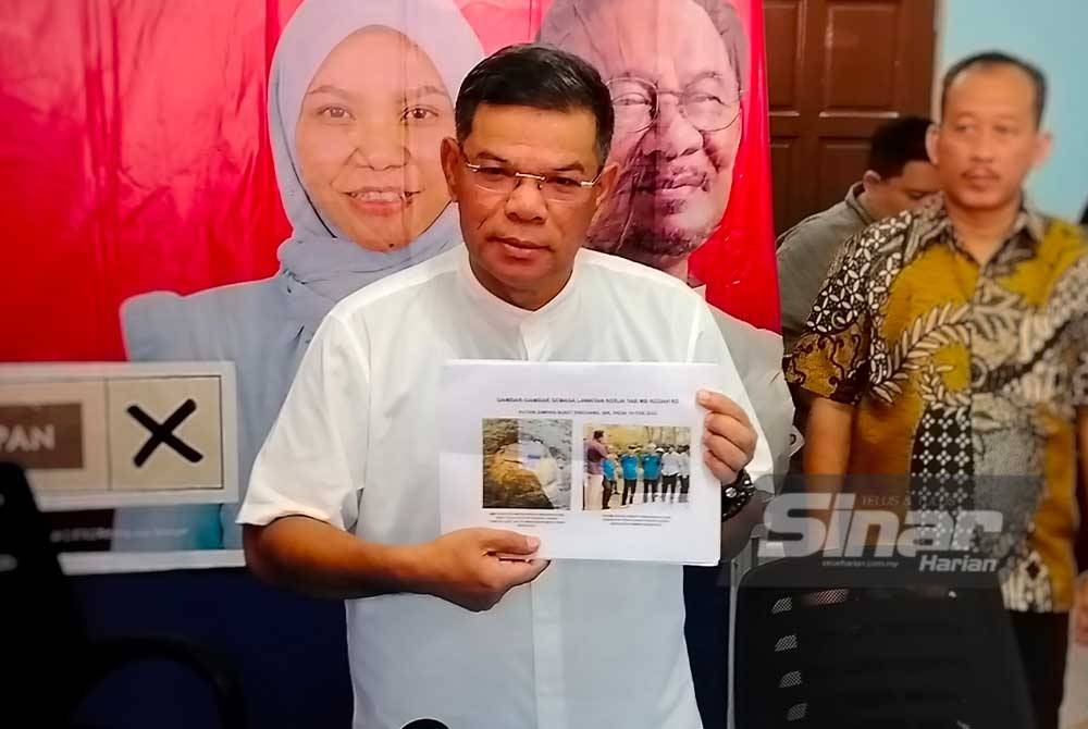 Saifuddin Nasution menunjukkan gambar lawatan tapak di Hutan Simpan Bukit Enggang oleh Muhammad Sanusi pada 19 Februari lalu.