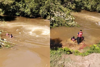 Anggota bomba ketika menjalankan kerja mencari mangsa di Taman Rekreasi Alor Lempah, Kuala Kubu Bharu, Hulu Selangor pada Ahad.