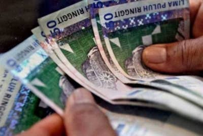 Ringgit ditutup rendah berbanding dolar AS pada Selasa, sejajar dengan kebanyakan mata wang negara serantau. - Gambar hiasan
