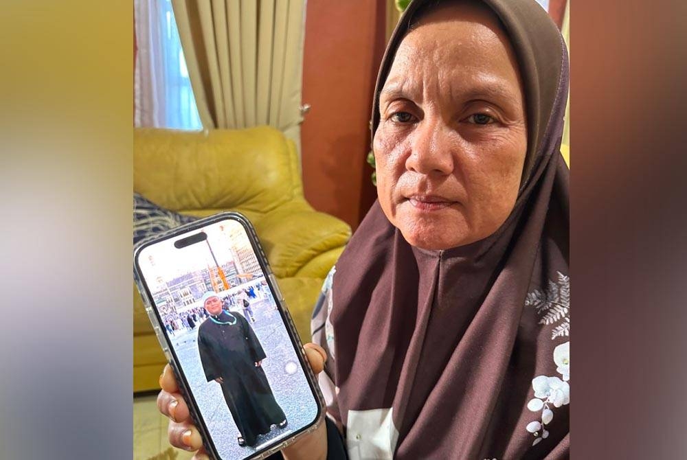 Zaini menunjukkan gambar Mohamad Aidil Anand.