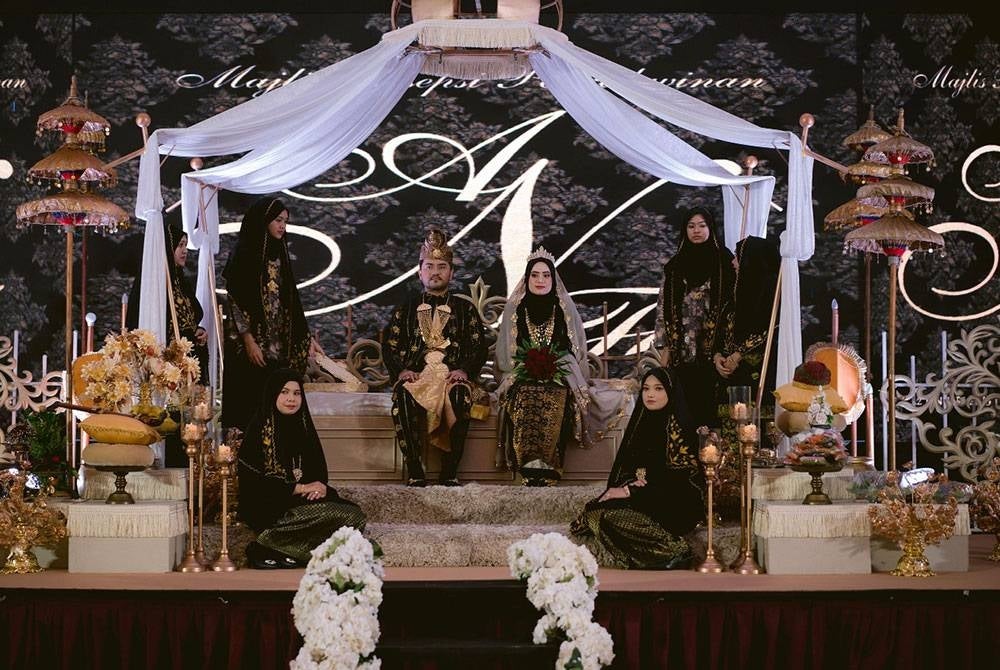 Nik Faiz (kiri) bersama Anis Najihah (kanan) ketika hari persandingan mereka pada Januari lalu. Foto: Ihsan Nik Faiz